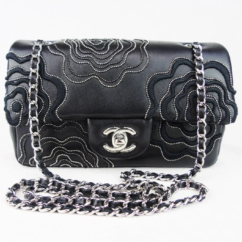 Chanel Designer Handbag with Unique DesignCHANEL 'Follies' black flap bag