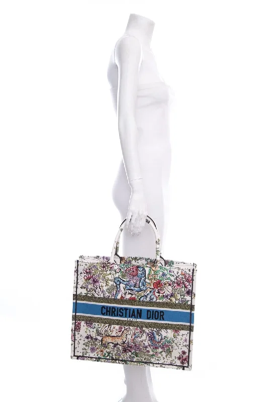 Christian Dior bags with a side - pocket for holding a water bottleDior White Floral Woodland Embroidered Book Tote HandBag